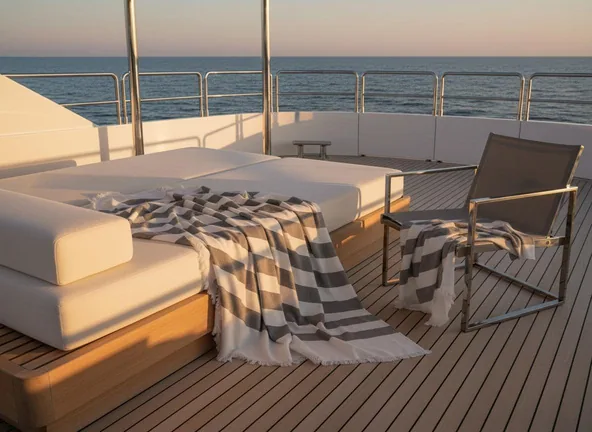 Towel and lounger on a yacht deck. Outdoor product scene